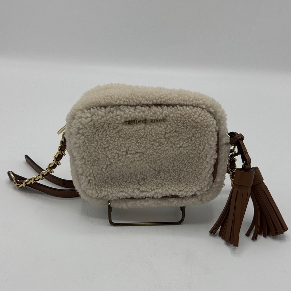 Micheal Kors Shearling Crossbody Bag with leather and gold chain strap.